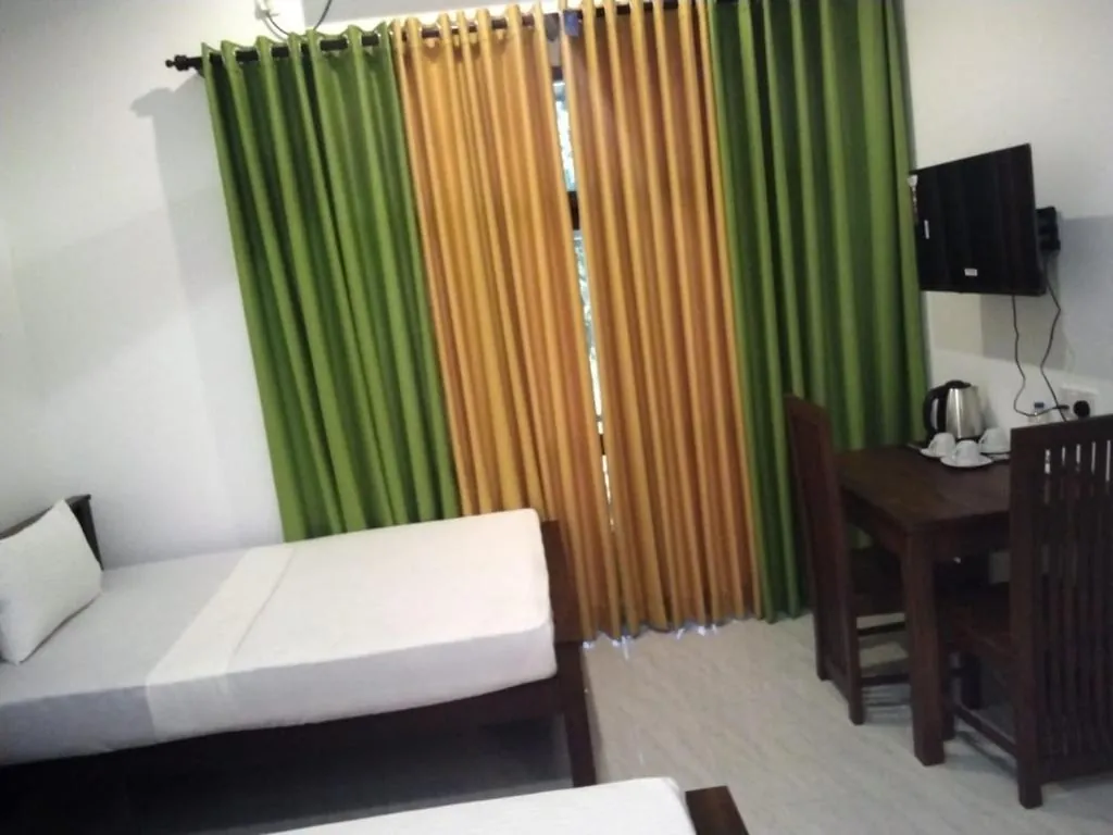 Extra room angle with curtains and table
