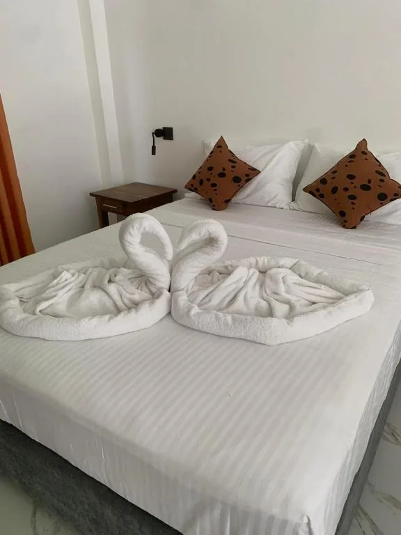 Close-up bed arrangement with towel design