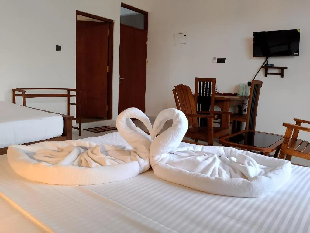Bed presentation with towel decor