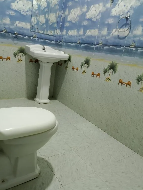 Bathroom area of the Deluxe Triple Room